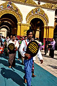 Ear piercing ceremony at Mahamuni Buddha Temple, Myanmar 